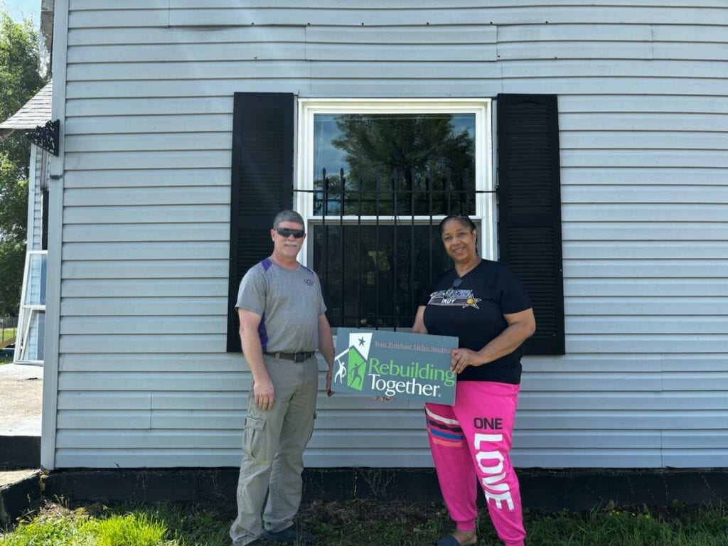 The Window Source of Indy is owned by Johnnie Ray Pennington.  He is posing with a homeowner and her newly installed window. The Window Source of Indy partnered with Rebuilding Together Indianapolis on this project. 